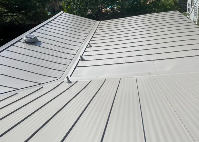 Solar attic fan installed on a metal roof for Roof Ventilation in Hawaiian Paradise Park